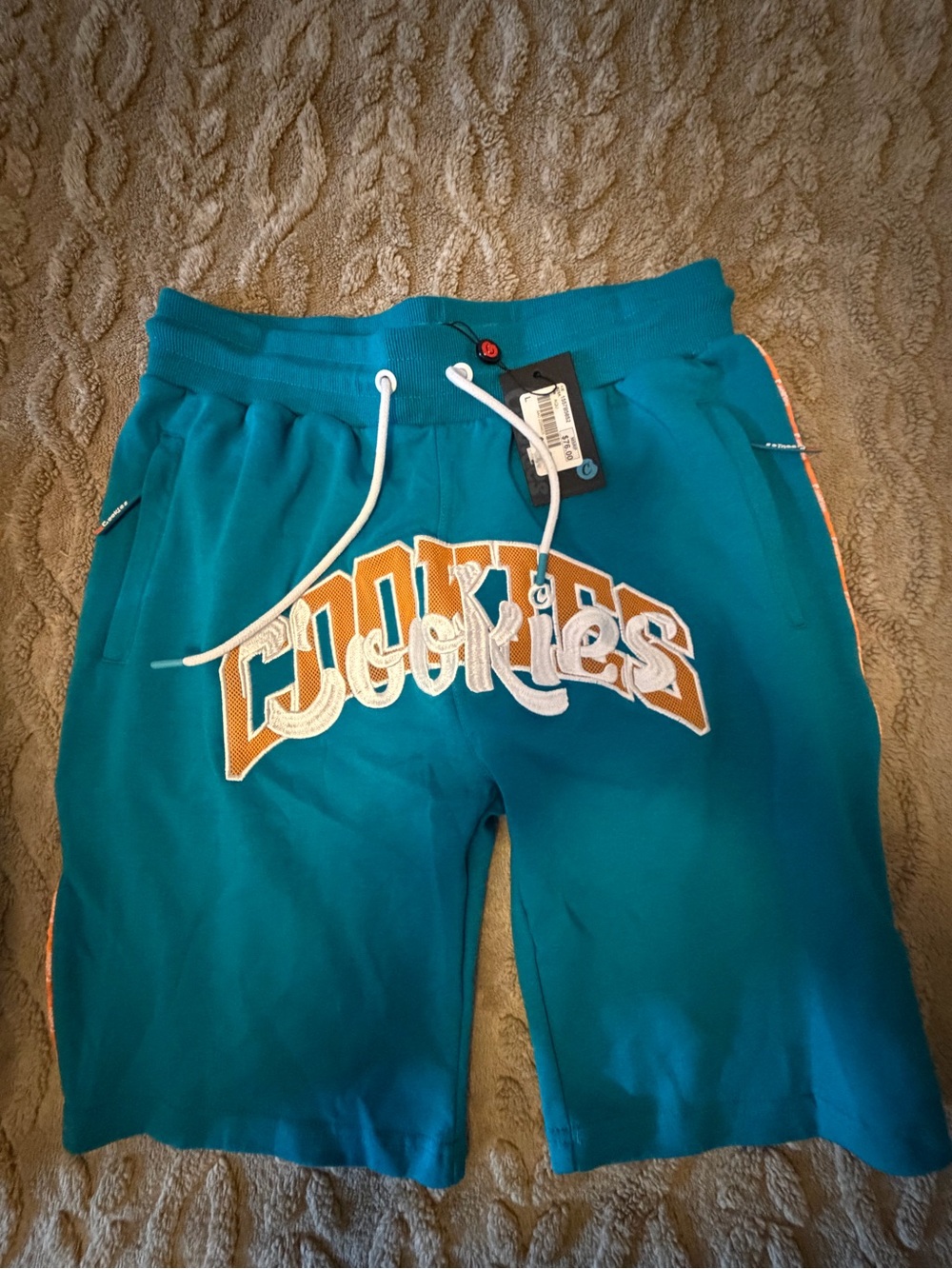 Teal Kids Shorts with Orange Logo
